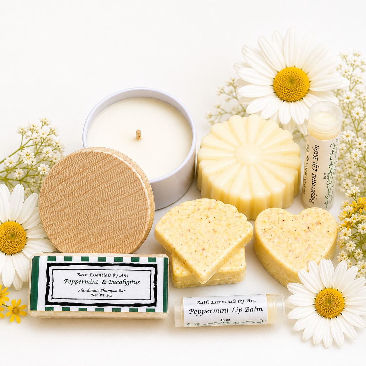 Tin candle with round lid, yellow soaps, and peppermint lip balm labels