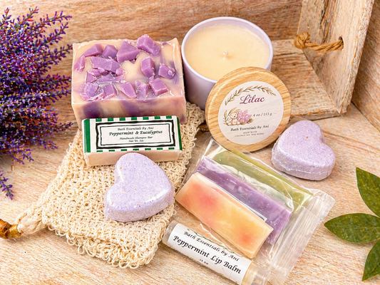 Self-care bath set with lilac soap bars, lip balm, body butter, and candle