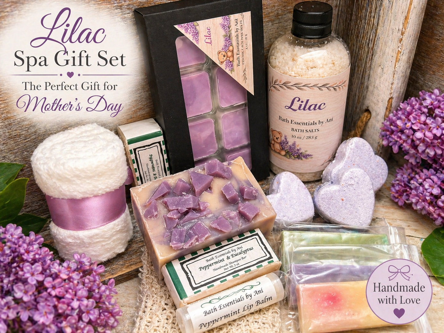 Lilac spa gift set with black box, bath bottles, soap bars, heart bath bombs, and tag
