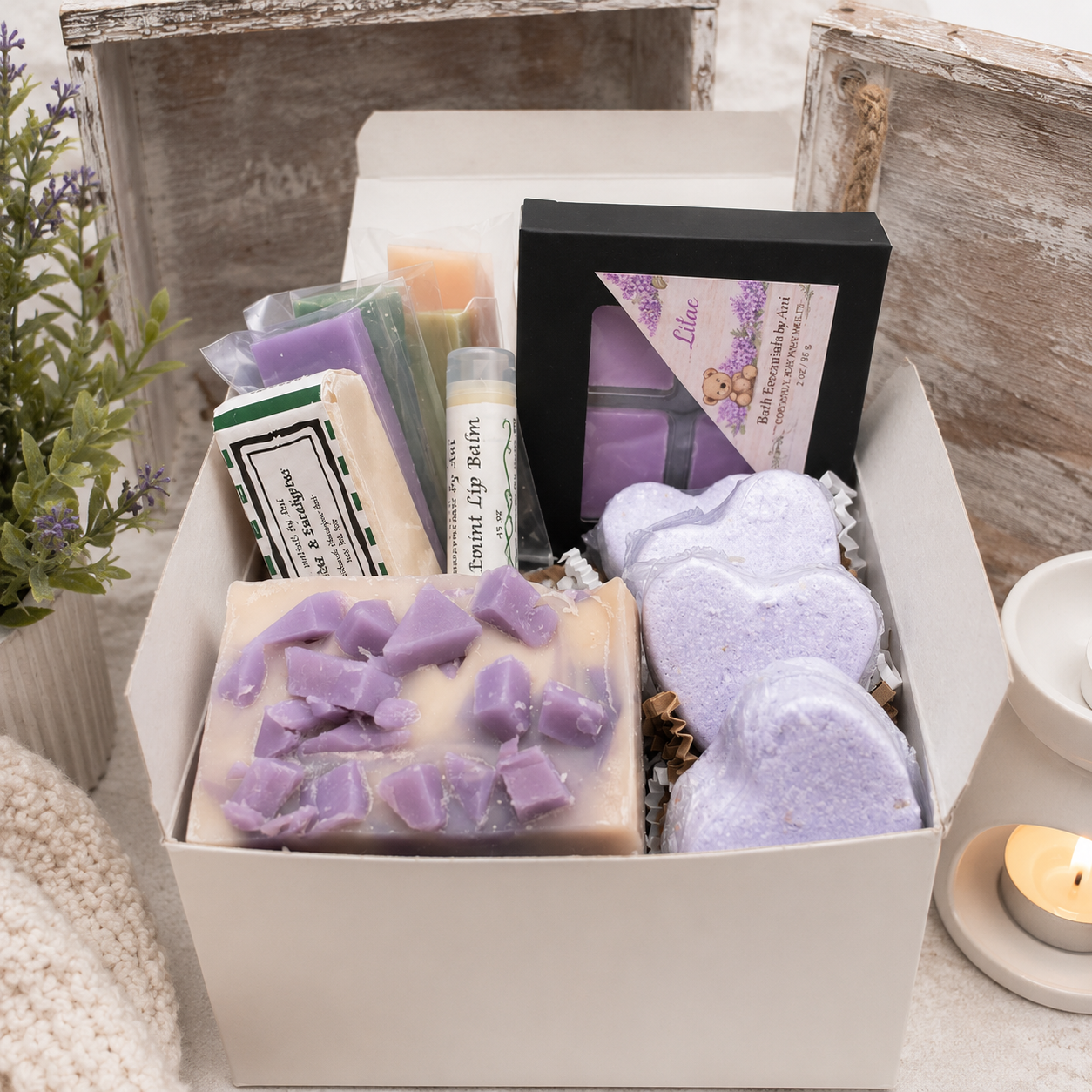 Handmade spa gift box with purple wax melts, soap bars, and spa-scented accessories