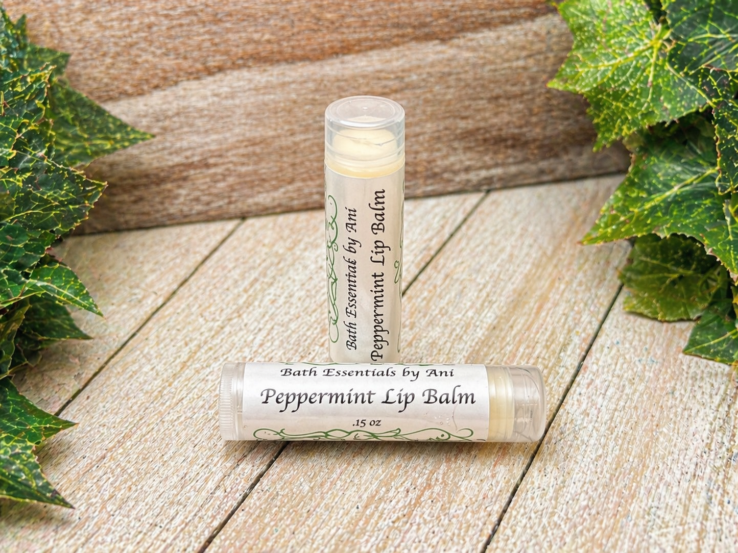 Peppermint lip balm tube with Mountain Rain label and green ivy leaves