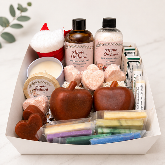 Apple-themed self-care gift basket with apple-shaped soaps, candle, and bath products