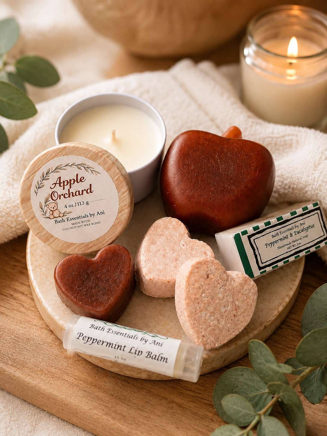 Apple spa gift set: round candle tin, heart soaps, and lip balm on wood tray