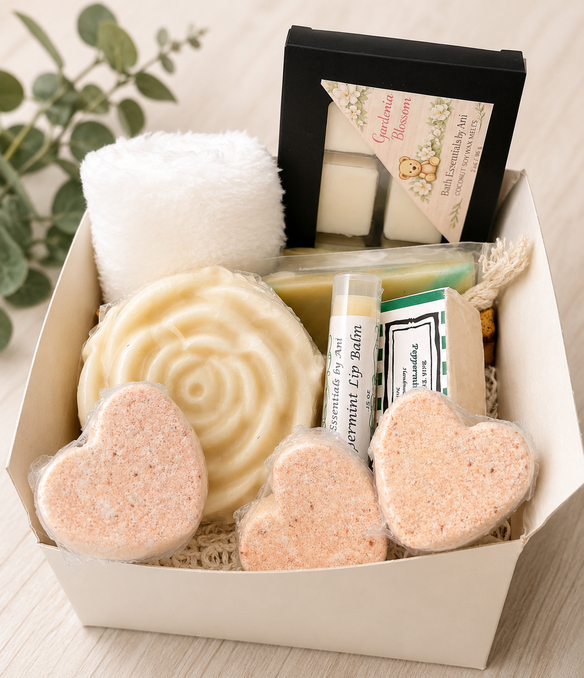 Gift box with towel roll, swirl soap, pink heart bath bombs and wax melt squares