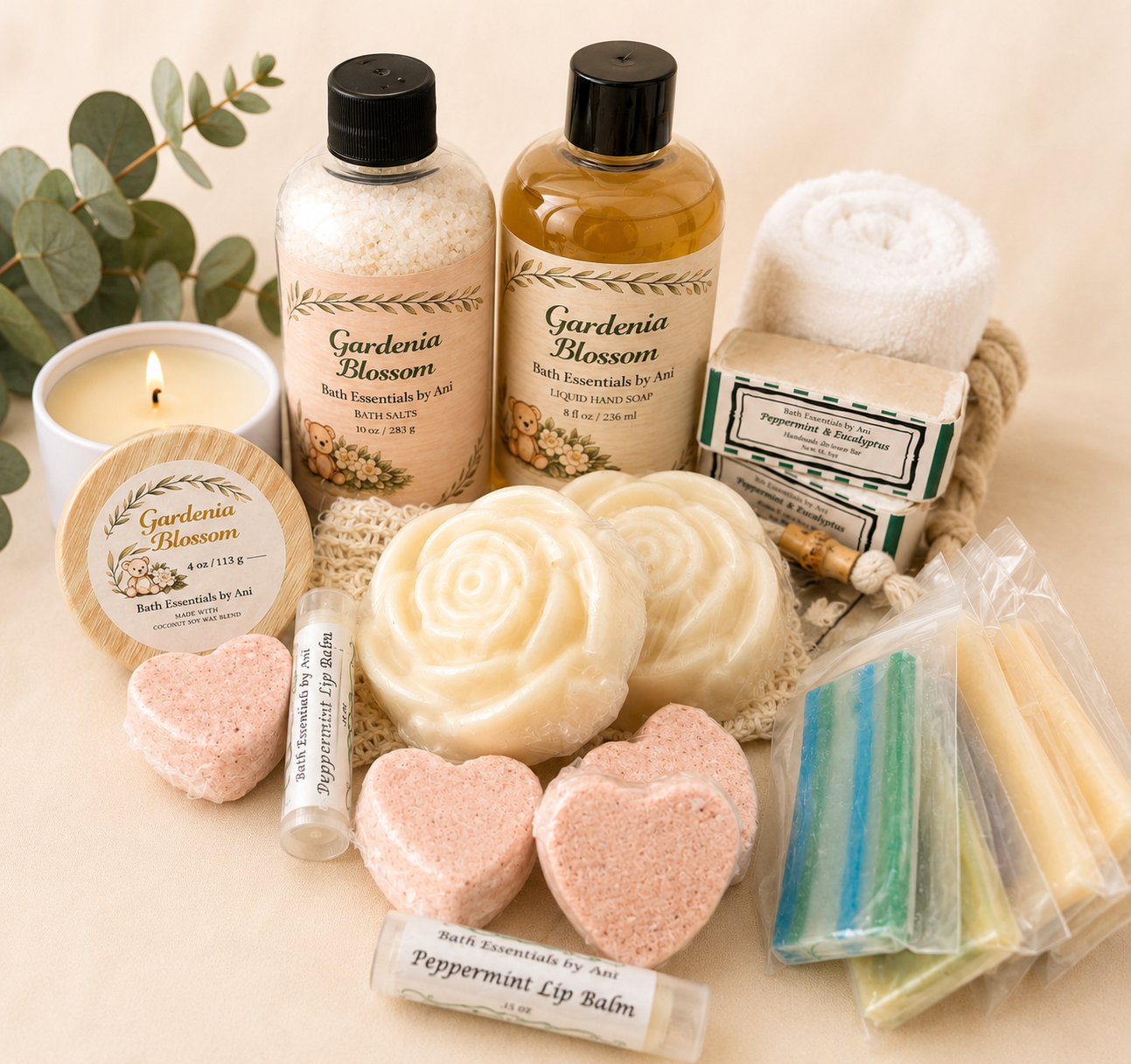 Spa gift box contents: candle, amber bottles, balm tube, soap bars, and bath essentials.
