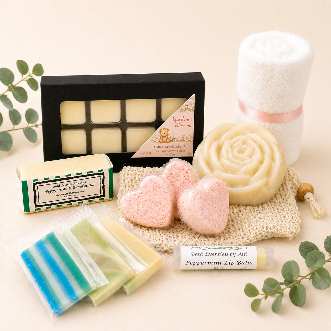 Bath gift set with wax melts, pink heart bath bombs, swirl soap, towel roll and mint soap bar