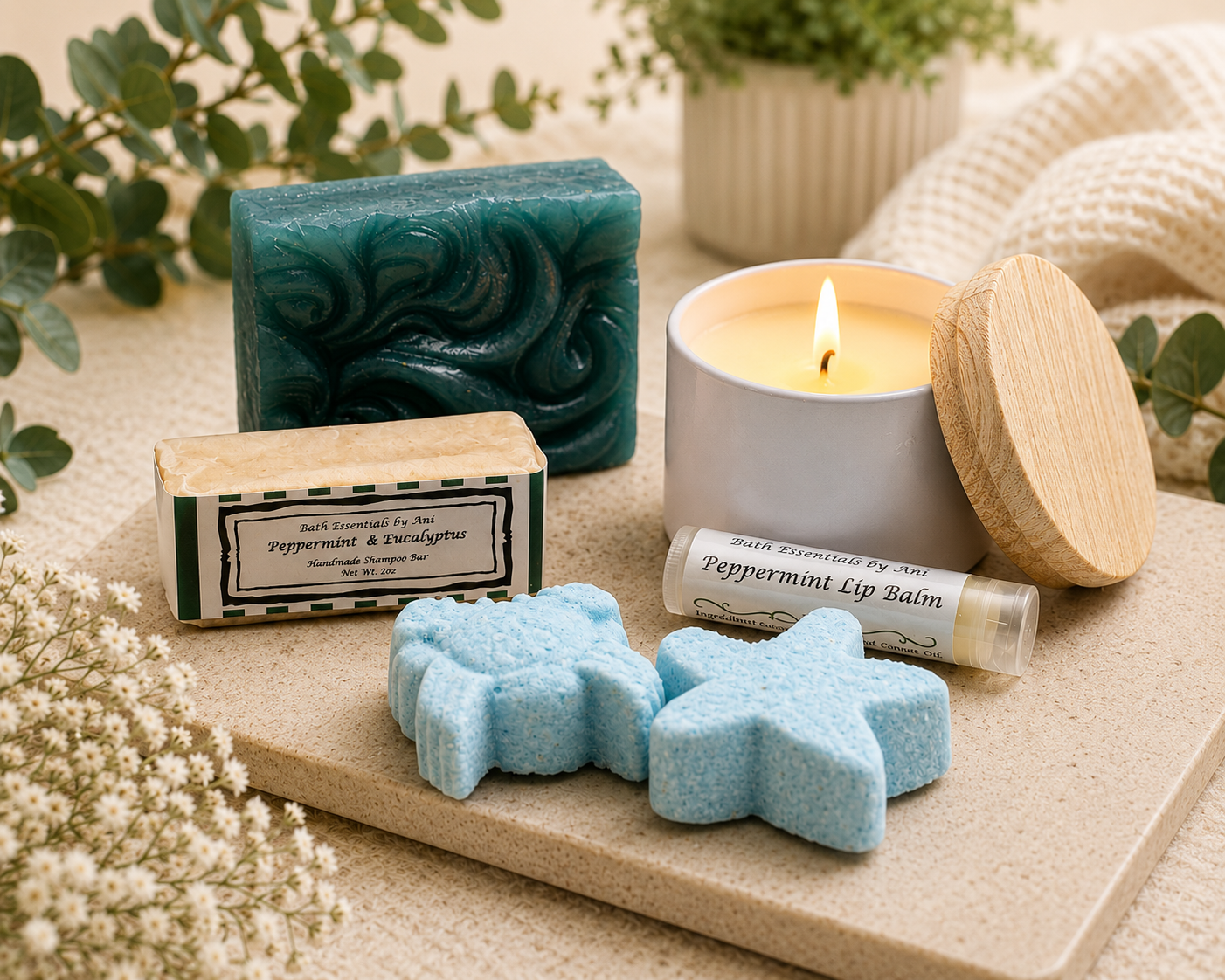 Spa self-care tray with teal soap bar, blue bath bombs, peppermint lip balm, and candle