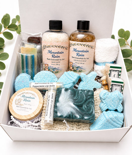 Spa gift box with blue bath soaps, bath salts, lip balm, candle and bath bombs