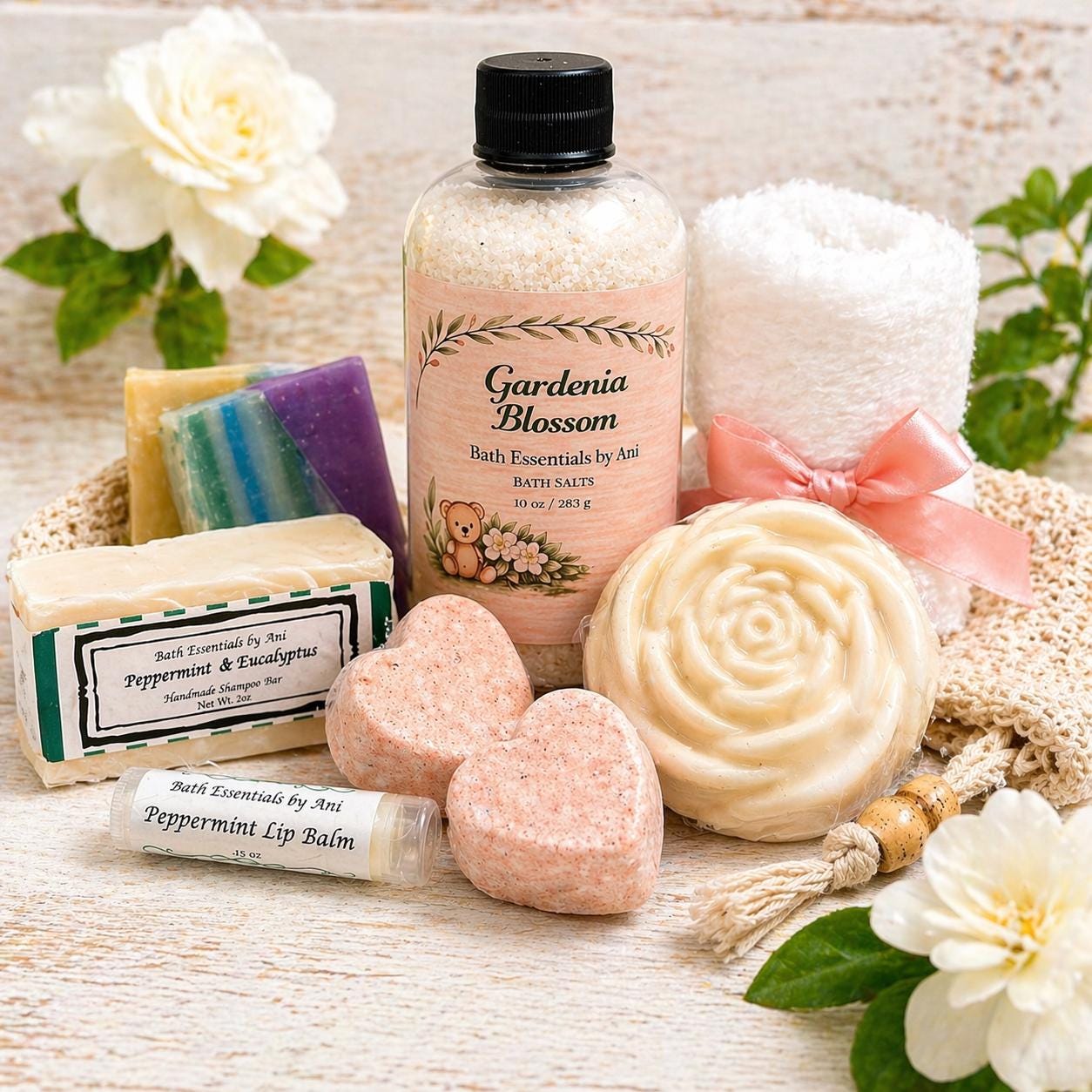 Bath gift basket with gardenia bath salts bottle, rose soap, bath bars, and lip balm
