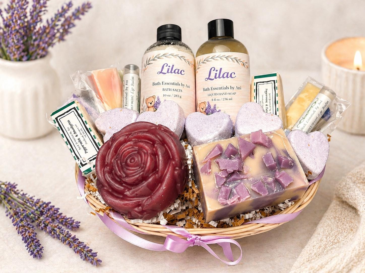 Lilac bath gift basket with bottles, soaps, heart bath bombs, and lilac accents