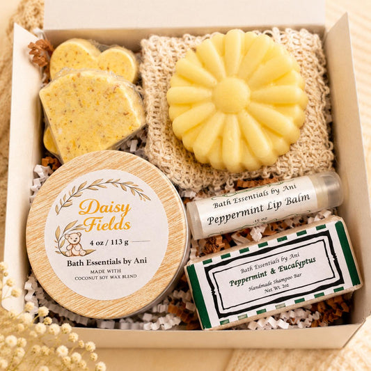 Spa gift box with yellow soaps, candle, and peppermint lip balm