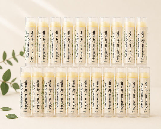 Peppermint lip balm favor sticks in clear tubes, labeled, arranged in rows