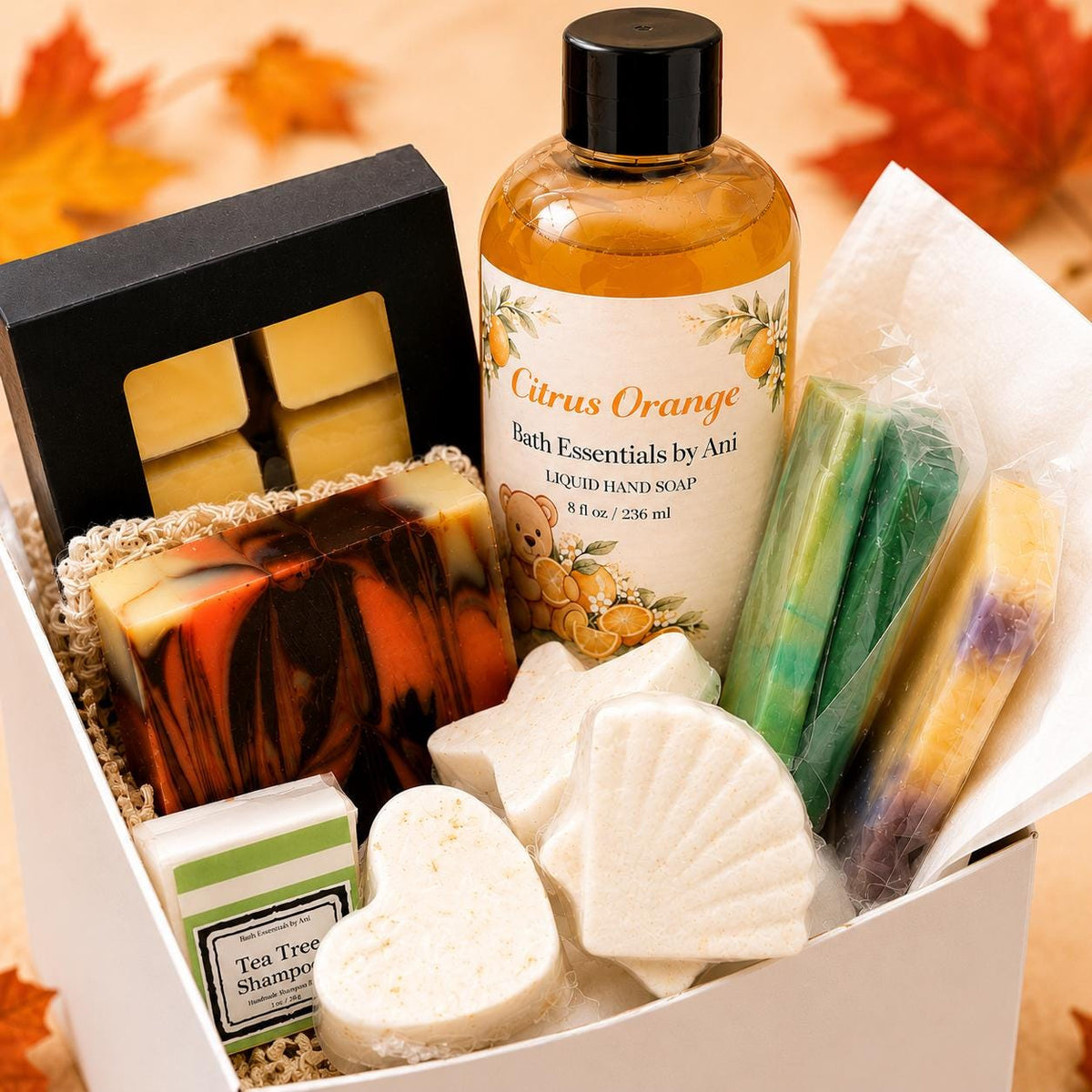 Spa gift box with Citrus Orange bath essentials, soaps, bath bombs, and tea tree shampoo bar